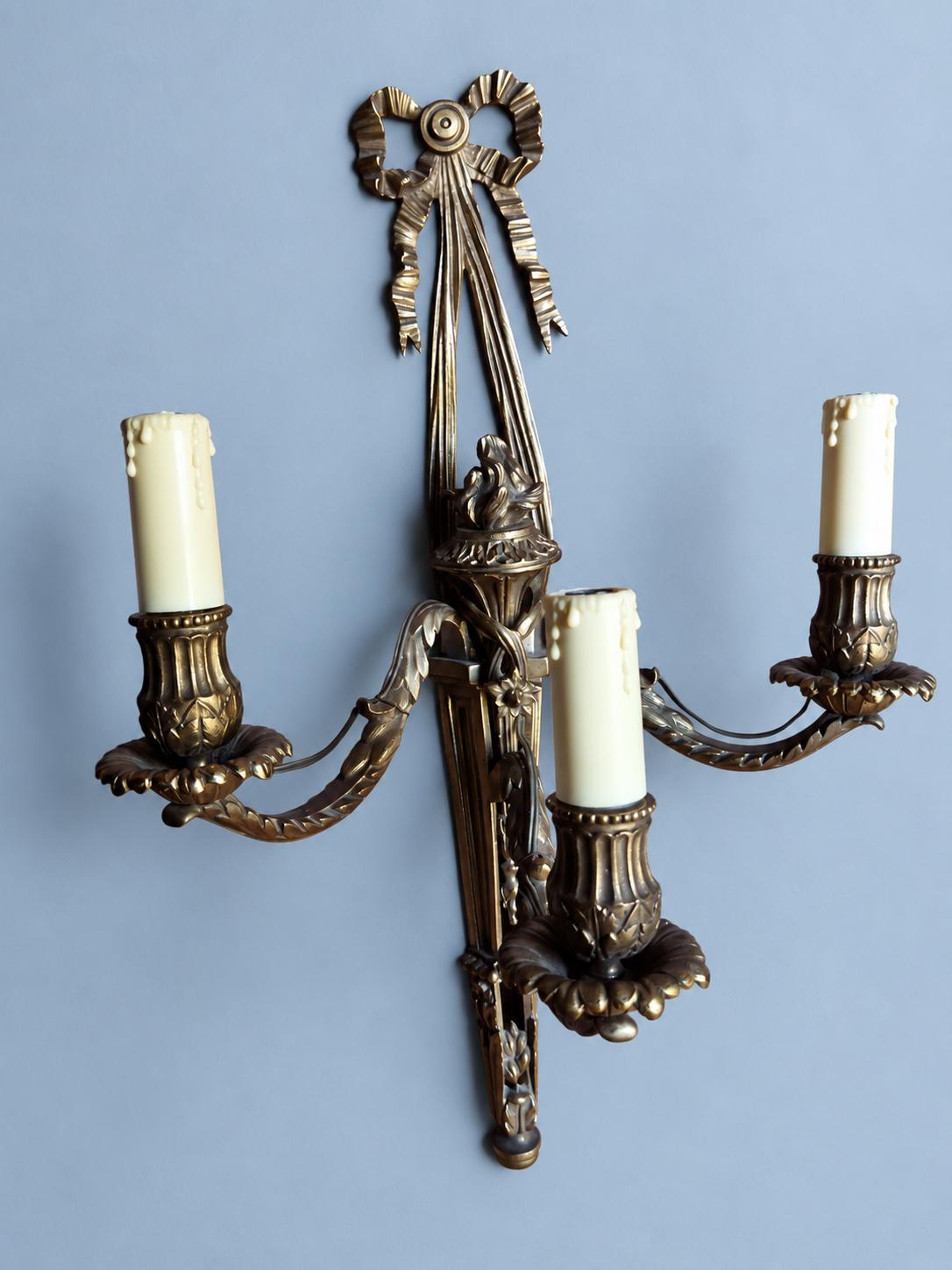 Vintage Louis XVI Style Three-Light Bronze-Tone Torch Wall Sconce with Ribbon Bow Crest