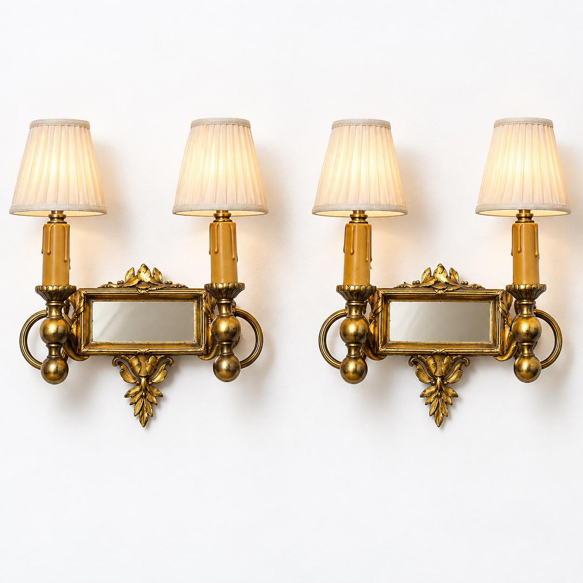 Vintage Pair of Louis XVI Style Two-Arm Gilt Metal Mirror Wall Sconces with Laurel Crests