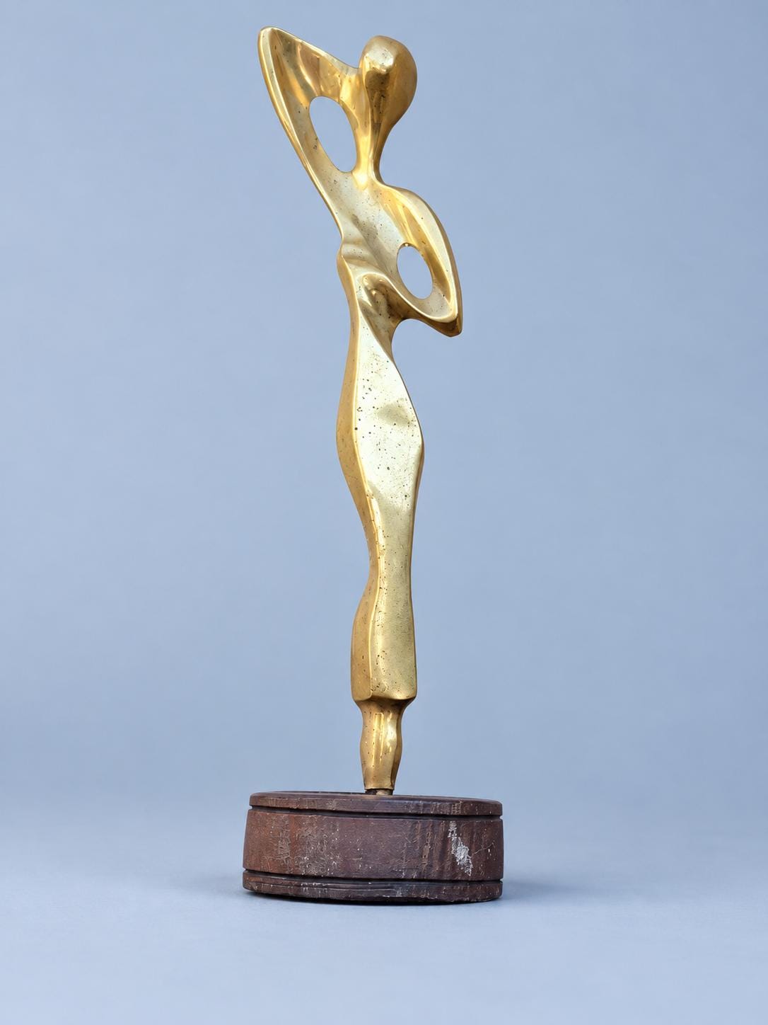 Contemporary Abstract Female Figure Sculpture, Gold-Tone Metal with Raised Arms, Modernist Style on Round Base, 24 cm