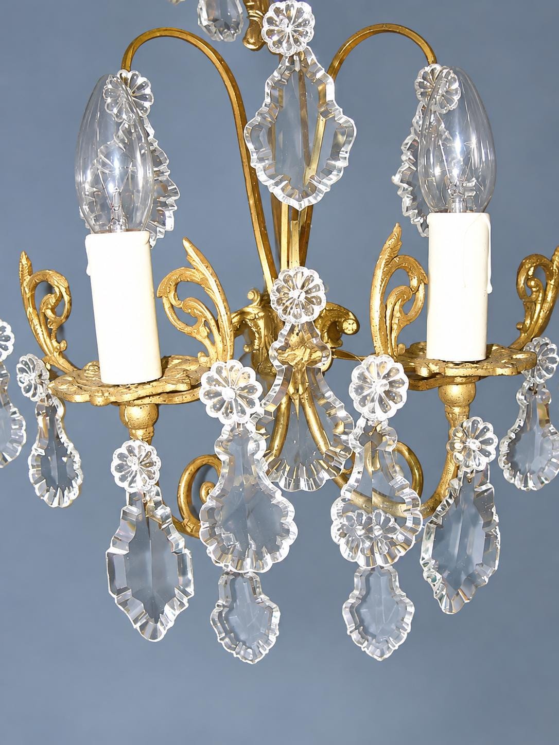 Vintage Pair of Gilt Metal Wall Sconces with Faceted Glass Drops, Two Lights Each, Scrolled Arms and Arched Hoops, Early 20th Century, 33 cm