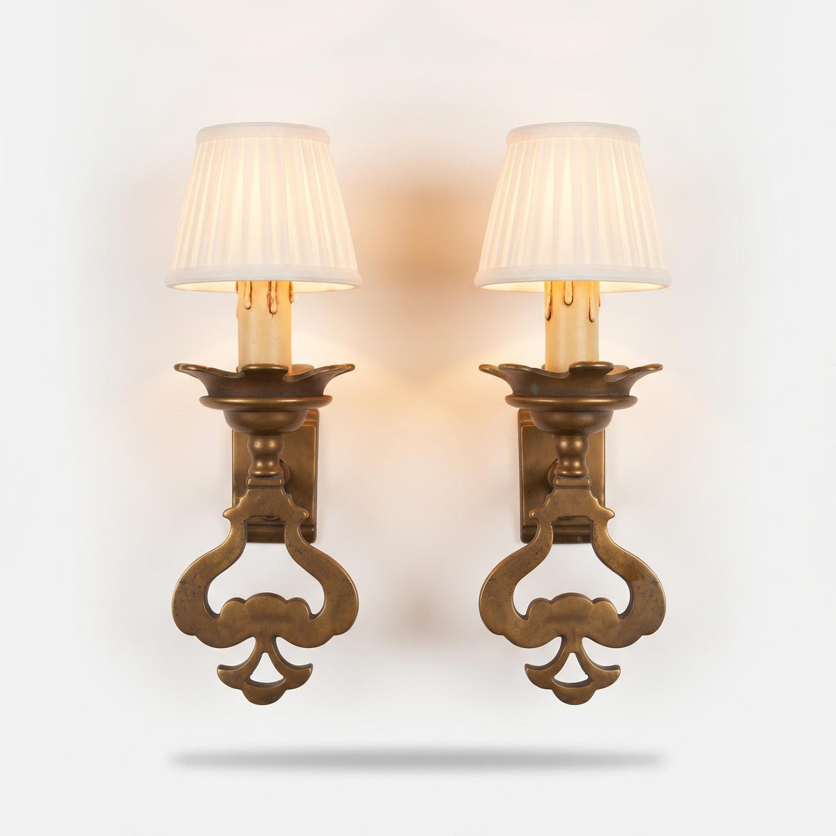 Vintage Pair of Patinated Metal Single-Light Wall Sconces, Pierced Spade-Shaped Body with Scalloped Drip Pans, Rustic Old World Wall Lights