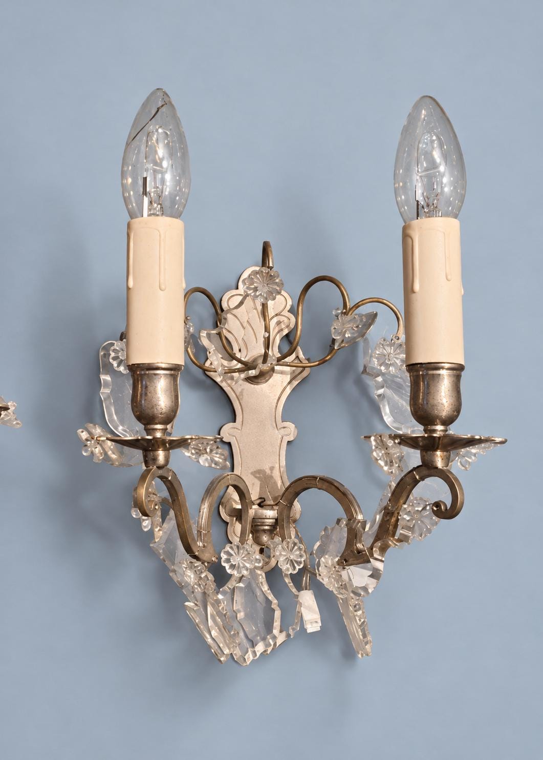 Pair of Vintage Louis XV Style Nickel-Plated Brass Wall Sconces with Crystal Drops, Two-Arm Silver-Tone Lights, Circa 1920s–1940s