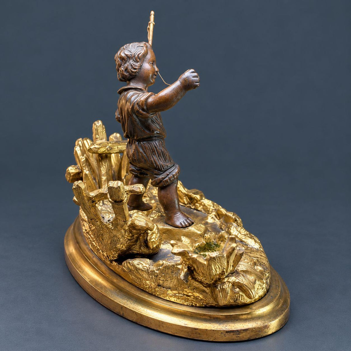 Antique 19th Century Gilt Bronze Match Holder, Young Boy Fishing with Rod and Fish on Reed-Covered Bank, Smoker’s Pyrogene