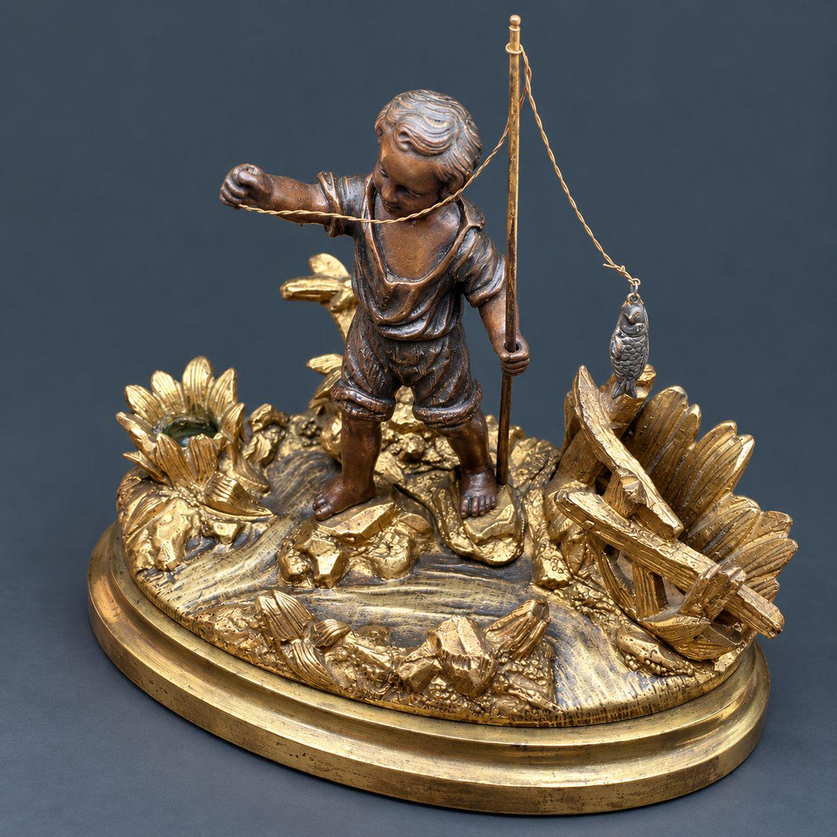 Antique 19th Century Gilt Bronze Match Holder, Young Boy Fishing with Rod and Fish on Reed-Covered Bank, Smoker’s Pyrogene