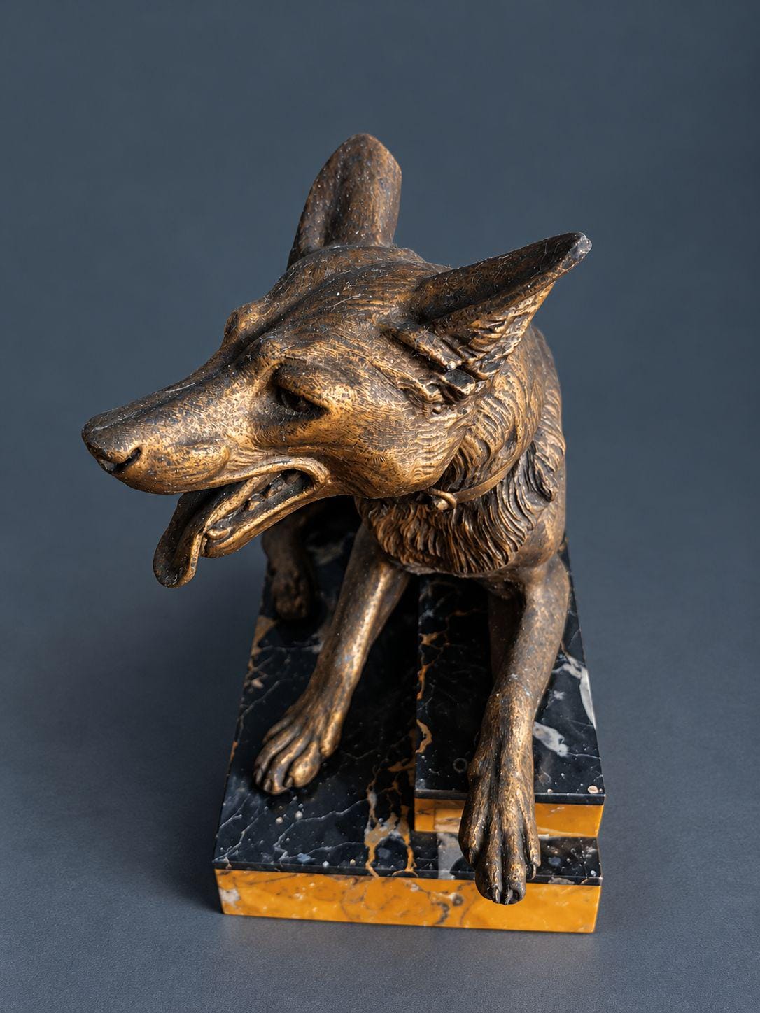 Vintage Art Deco L. Carvin Spelter German Shepherd Dog Sculpture, Signed on Collar, Reclining on Sienna and Portoro Marble Base