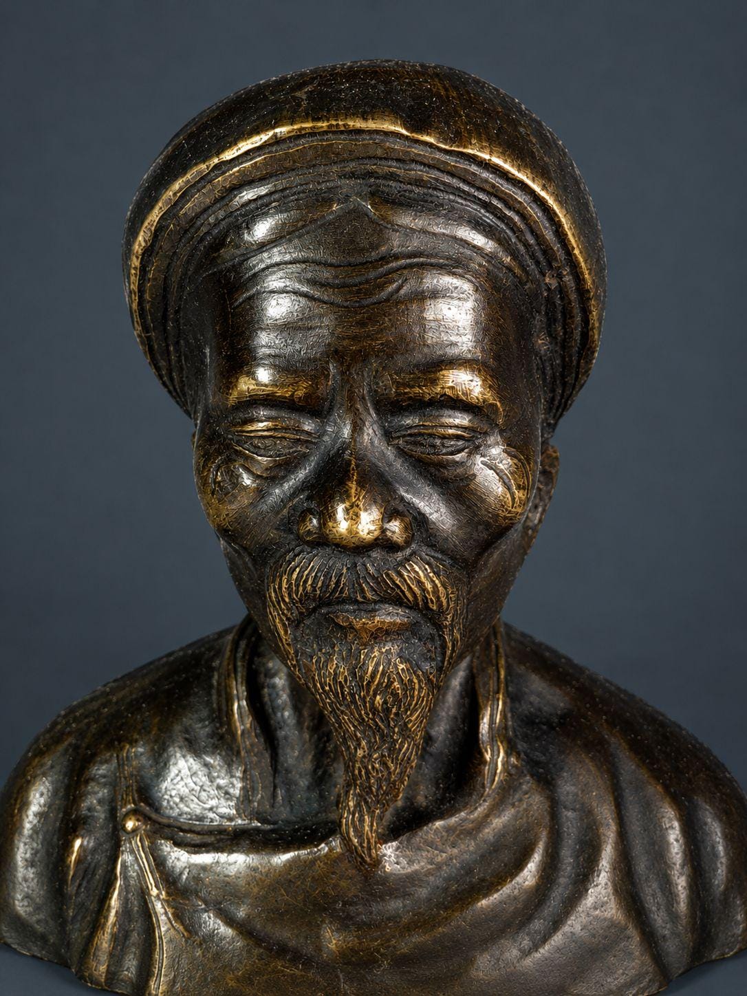 Pair of Antique Patinated Bronze Busts, Elderly Vietnamese Man and Woman in Traditional Khan Turbans, circa 1900