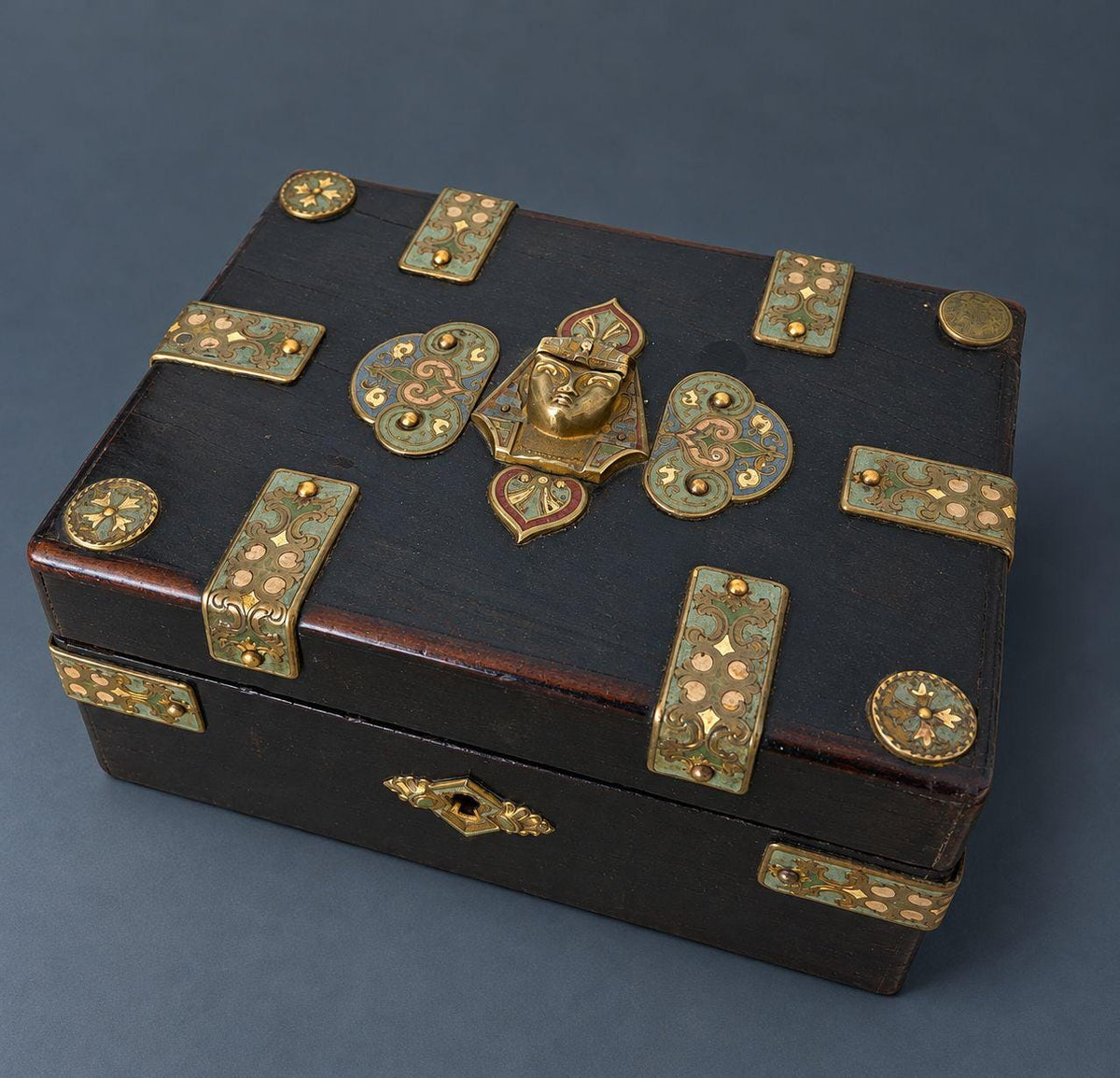 Antique Napoleon III Egyptian Revival Ebonized Box with Enameled Brass Pharaoh Head and Strapwork Mounts, Purple Silk Lining