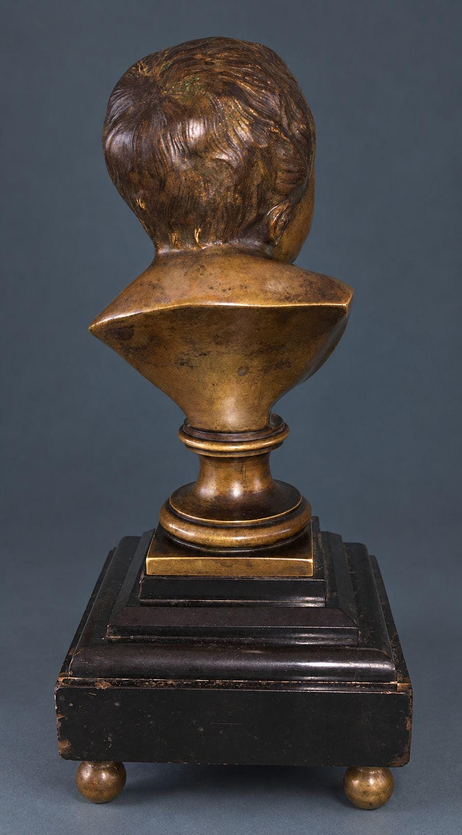 Pair of Antique Napoleon III Bronze Baby Busts After Houdon, Laughing and Crying Children on Black Marble Bases, Ball Feet