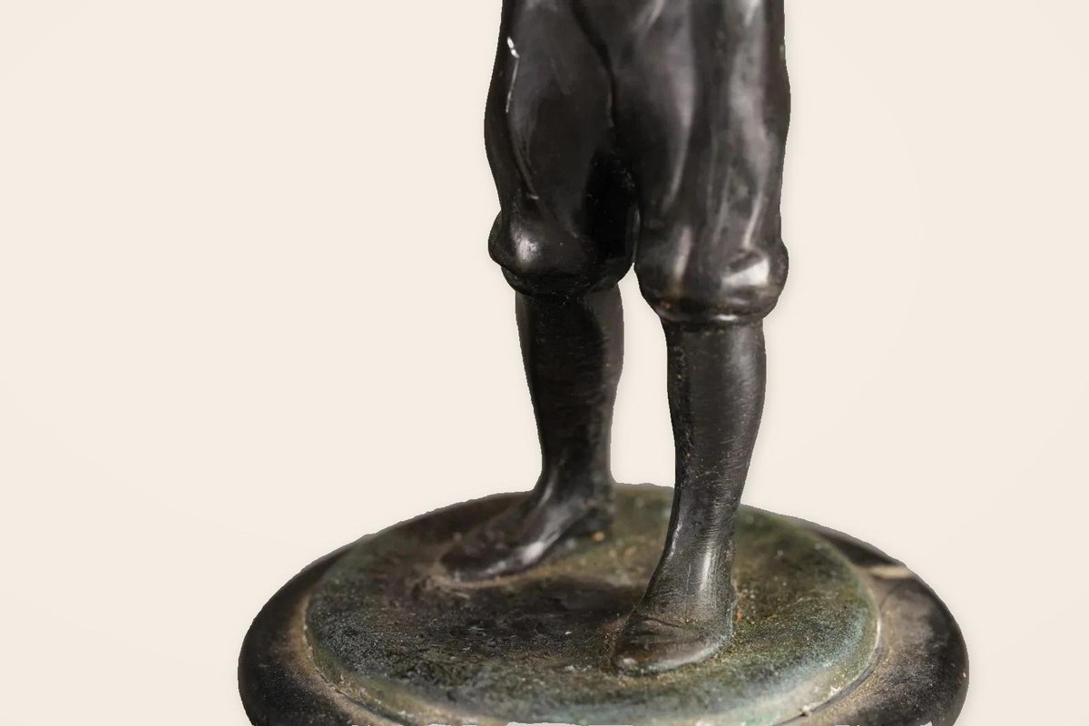 Pair of Antique Bronze Figures of Country Children, Girl in Bonnet and Boy Shading His Eyes, on Turned Bases, circa 1900
