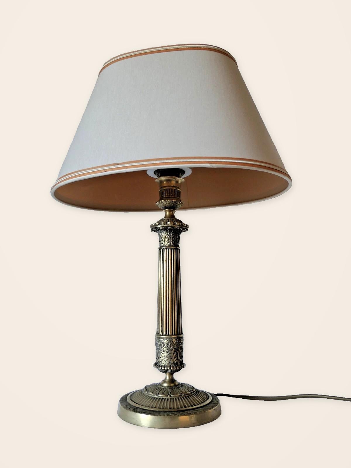Vintage Empire Style Bronze Column Table Lamp, Fluted Candlestick Base with Palmette Band, Oval Ivory Shade with Apricot Trim