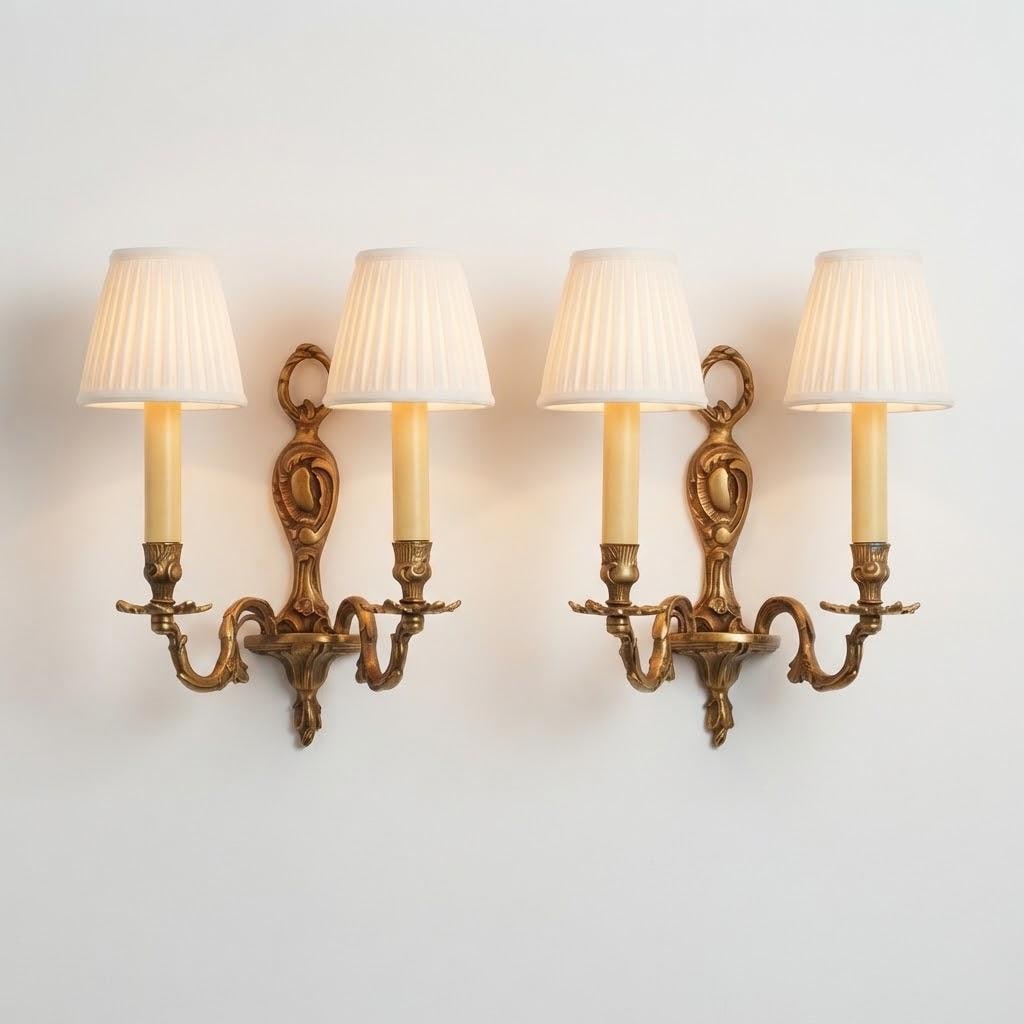 Pair of Vintage 1970s Bronze Louis XV Style Wall Sconces, Two-Arm Design with Laurel Ring Crest and Cartouche Backplate, Candle Lights