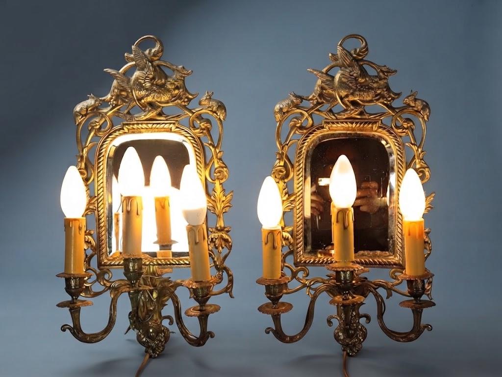 Pair of Antique Bronze Mirrored Wall Sconces, Three-Light Girandoles with Rabbits, Winged Bird Crest and Beveled Glass, 1890s