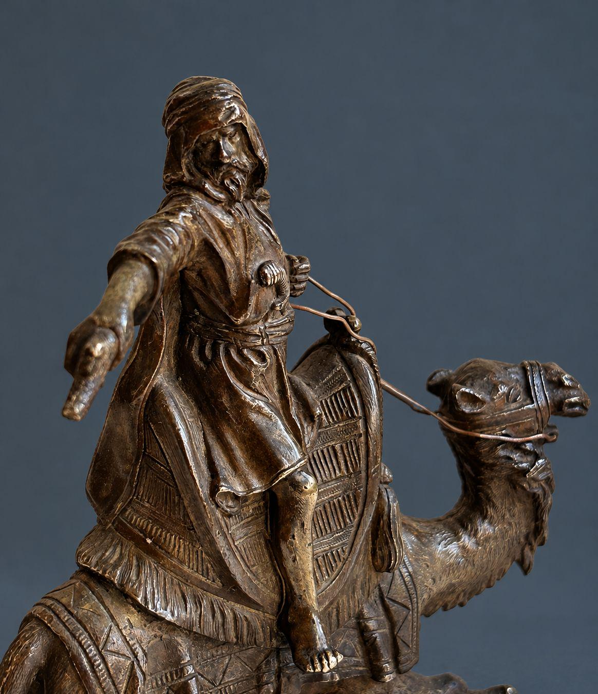 Antique Vienna Style Patinated Bronze Bedouin Rider on Camel, Orientalist Sculpture with Pistol and Wire Reins, circa 1900