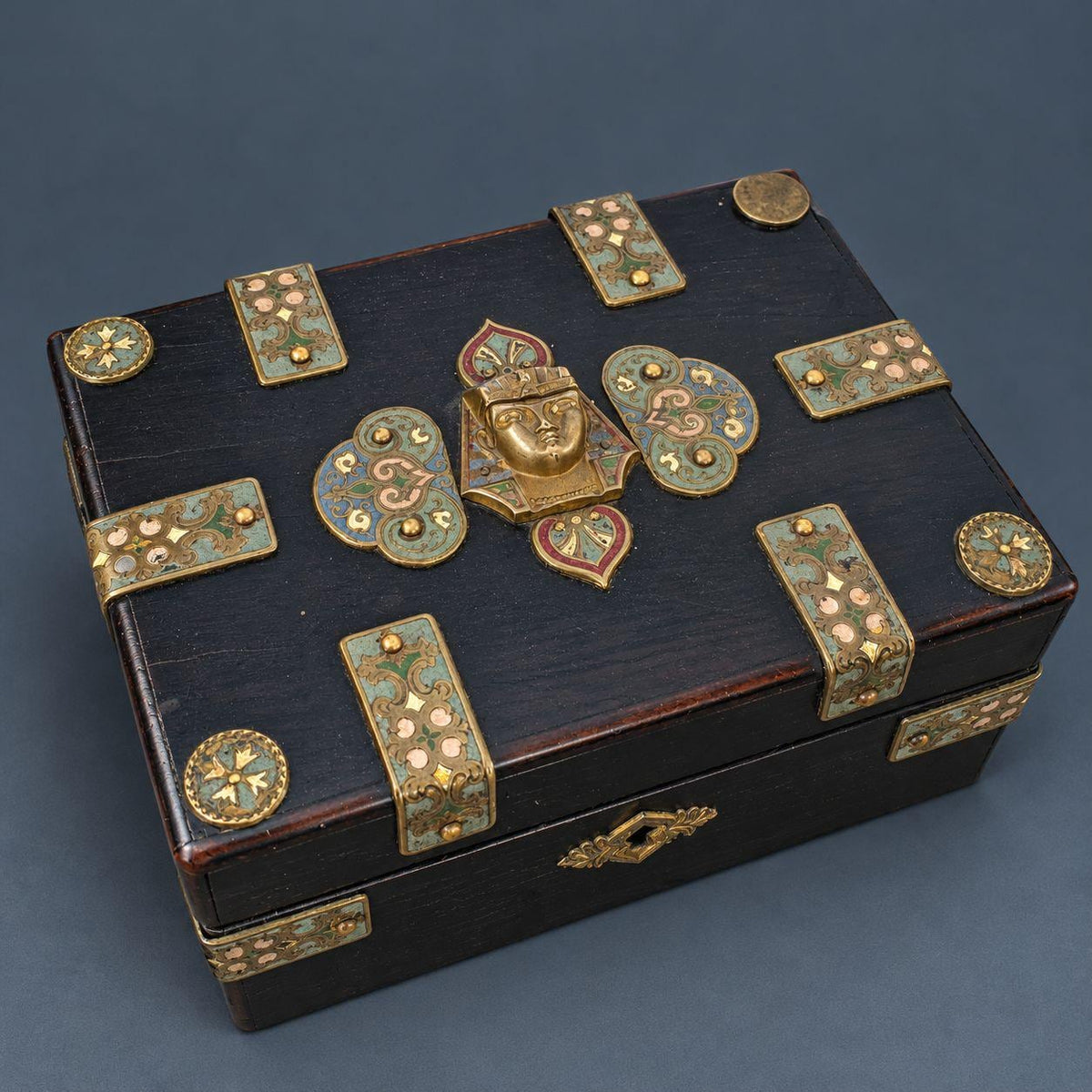 Antique Napoleon III Egyptian Revival Ebonized Box with Enameled Brass Pharaoh Head and Strapwork Mounts, Purple Silk Lining
