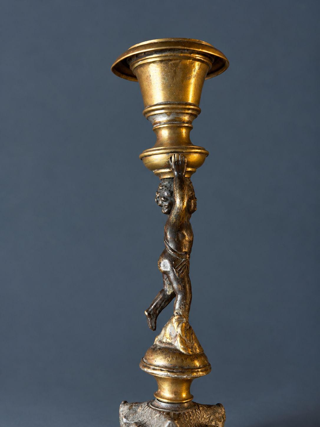 Pair of Antique Restauration Era Cherub Candlesticks, Bronze Putti Holding Brass Cups on Lion Paw Tripod Bases, 19th Century
