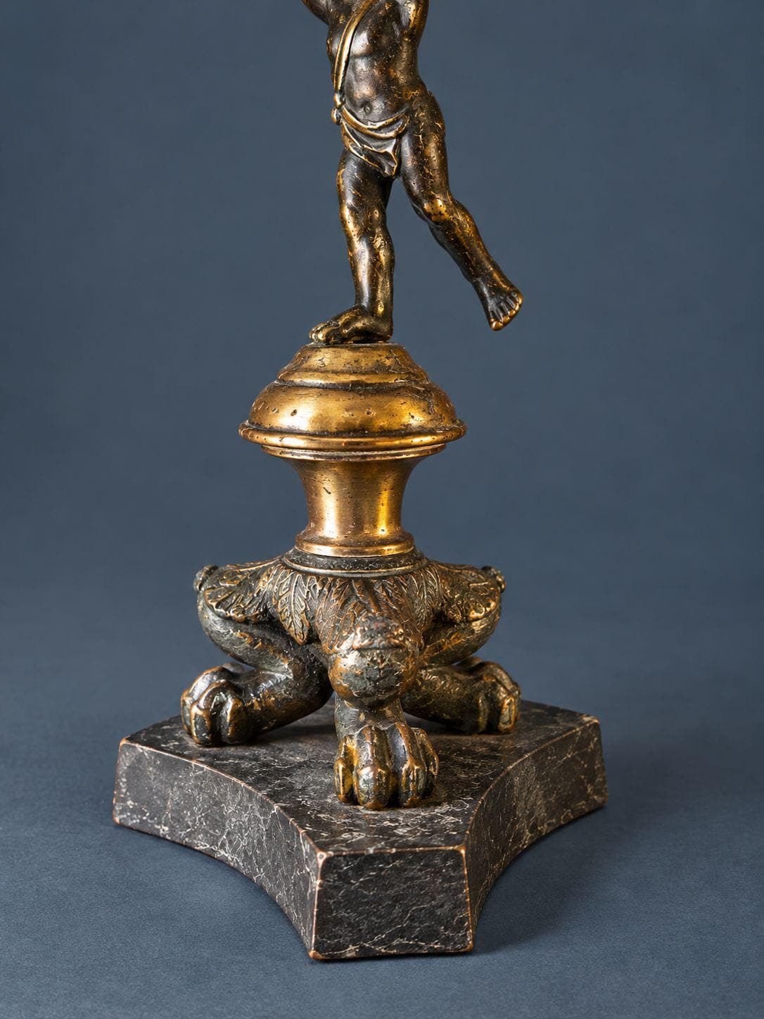 Pair of Antique Restauration Era Cherub Candlesticks, Bronze Putti Holding Brass Cups on Lion Paw Tripod Bases, 19th Century