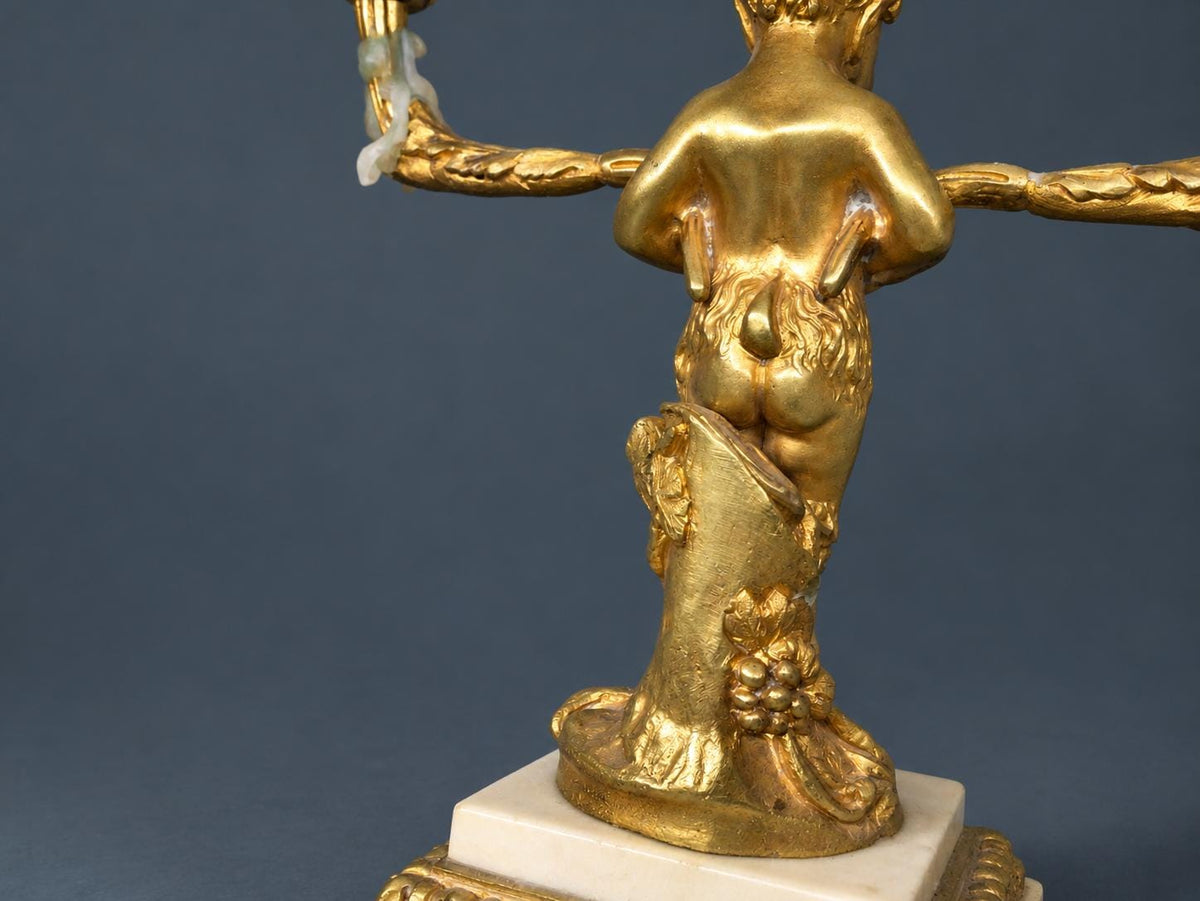 Pair of Antique Napoleon III Gilt Bronze Faun Candelabra, Young Satyrs Holding Laurel Garland Arms, White Marble Bases
