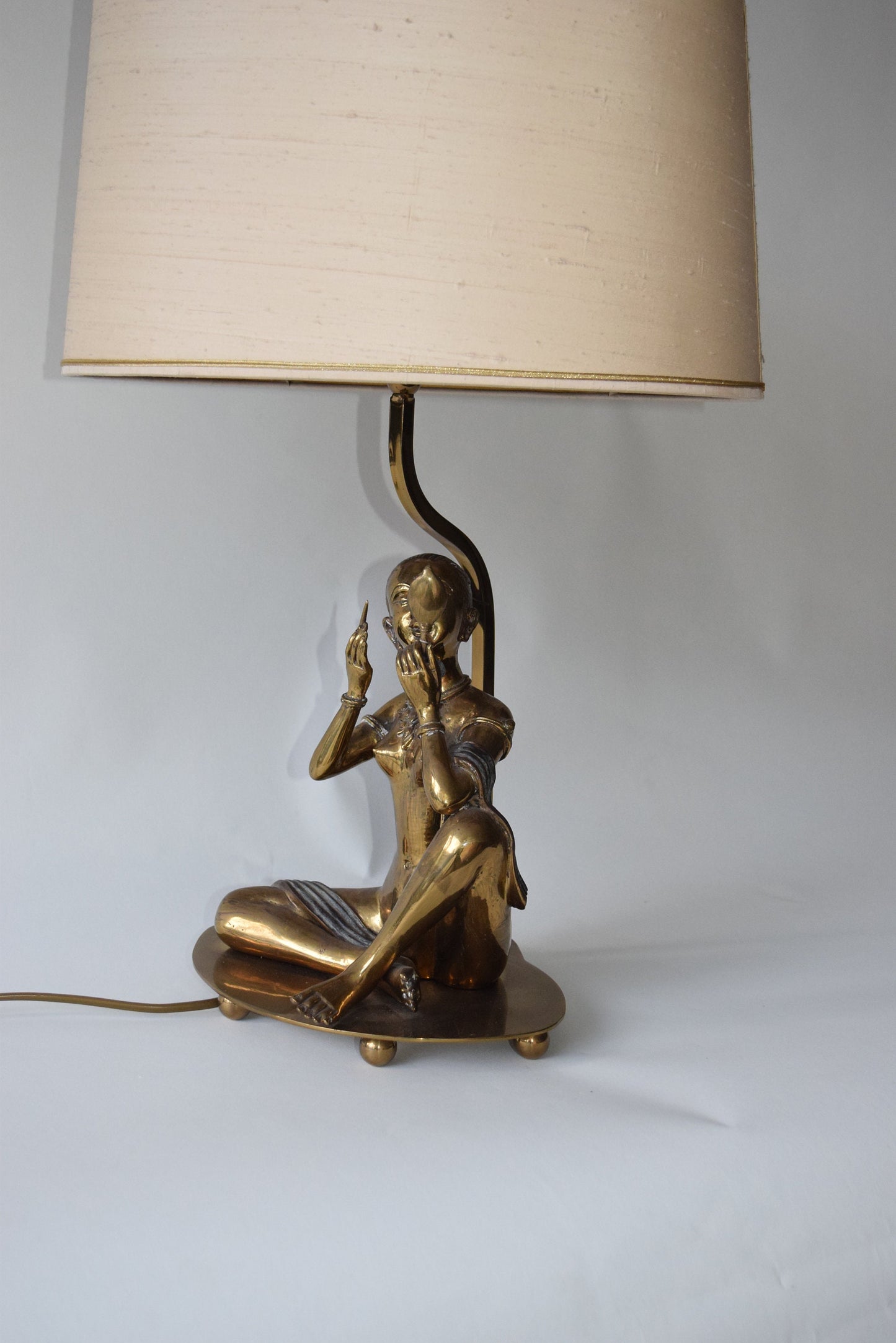 Vintage Brass sculpture lamp of a woman sitting