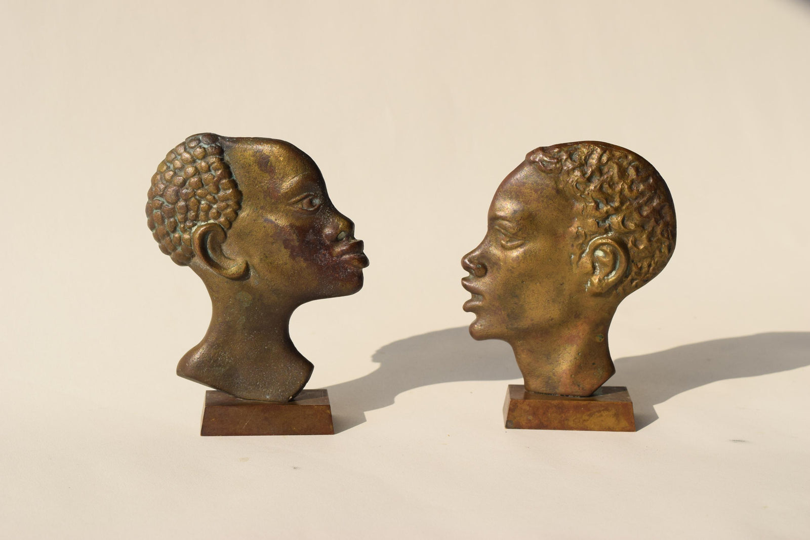 Midcentury Bronze-Toned Head Sculptures, Pair, Hagenauer Style, 1950s