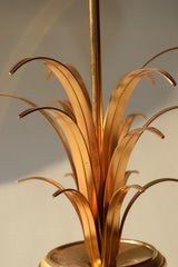 Vintage 1970s S.A. Boulanger Palm Pineapple Lamp featuring a gilded gold metal palm tree design mounted on a solid onyx base. This Belgian-made lamp exemplifies Hollywood Regency style, adding a touch of luxury and elegance to any interior space. With a height of 74 centimeters and a width of 24 centimeters, it's an ideal decorative piece for living rooms, bedrooms, or offices seeking vintage charm.
