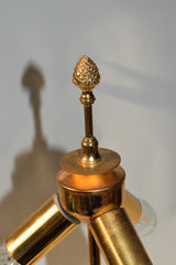 Vintage 1970s S.A. Boulanger Palm Pineapple Lamp featuring a gilded gold metal palm tree design mounted on a solid onyx base. This Belgian-made lamp exemplifies Hollywood Regency style, adding a touch of luxury and elegance to any interior space. With a height of 74 centimeters and a width of 24 centimeters, it's an ideal decorative piece for living rooms, bedrooms, or offices seeking vintage charm.