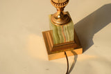 Vintage 1970s S.A. Boulanger Palm Pineapple Lamp featuring a gilded gold metal palm tree design mounted on a solid onyx base. This Belgian-made lamp exemplifies Hollywood Regency style, adding a touch of luxury and elegance to any interior space. With a height of 74 centimeters and a width of 24 centimeters, it's an ideal decorative piece for living rooms, bedrooms, or offices seeking vintage charm.