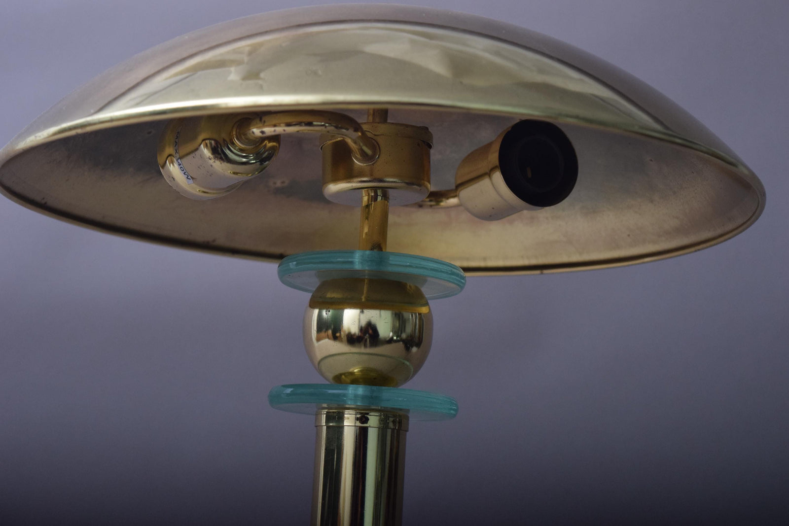 Elegant vintage mushroom lamp featuring a polished brass finish and a distinctive mushroom-shaped shade. This mid-century modern table lamp adds a touch of retro charm to any room, making it perfect for bedside tables, desks, or reading nooks. Its warm, ambient light creates an inviting atmosphere, while the compact design ensures it fits seamlessly into various interior spaces.