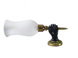 Pair of Art Deco solid brass wall sconces from the 1930s featuring a fist holding torch design, ideal for vintage and antique home décor.