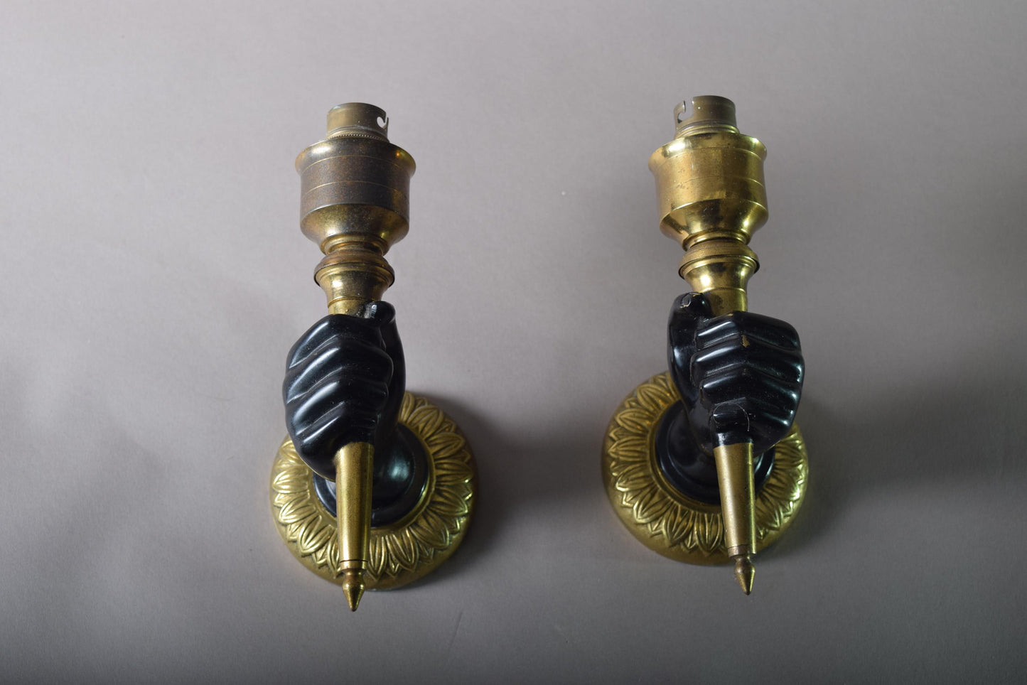 Art Deco Pair of solid brass wall scones fist holding torch 1930s