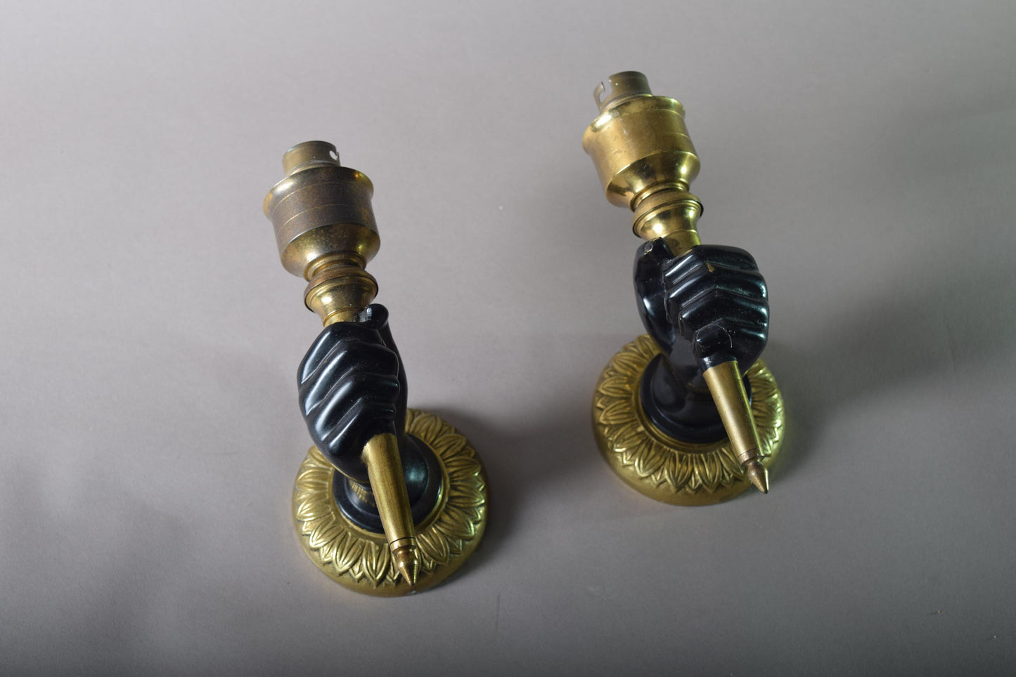 Art Deco Pair of solid brass wall scones fist holding torch 1930s