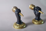 Pair of Art Deco solid brass wall sconces from the 1930s featuring a fist holding torch design, ideal for vintage and antique home décor.