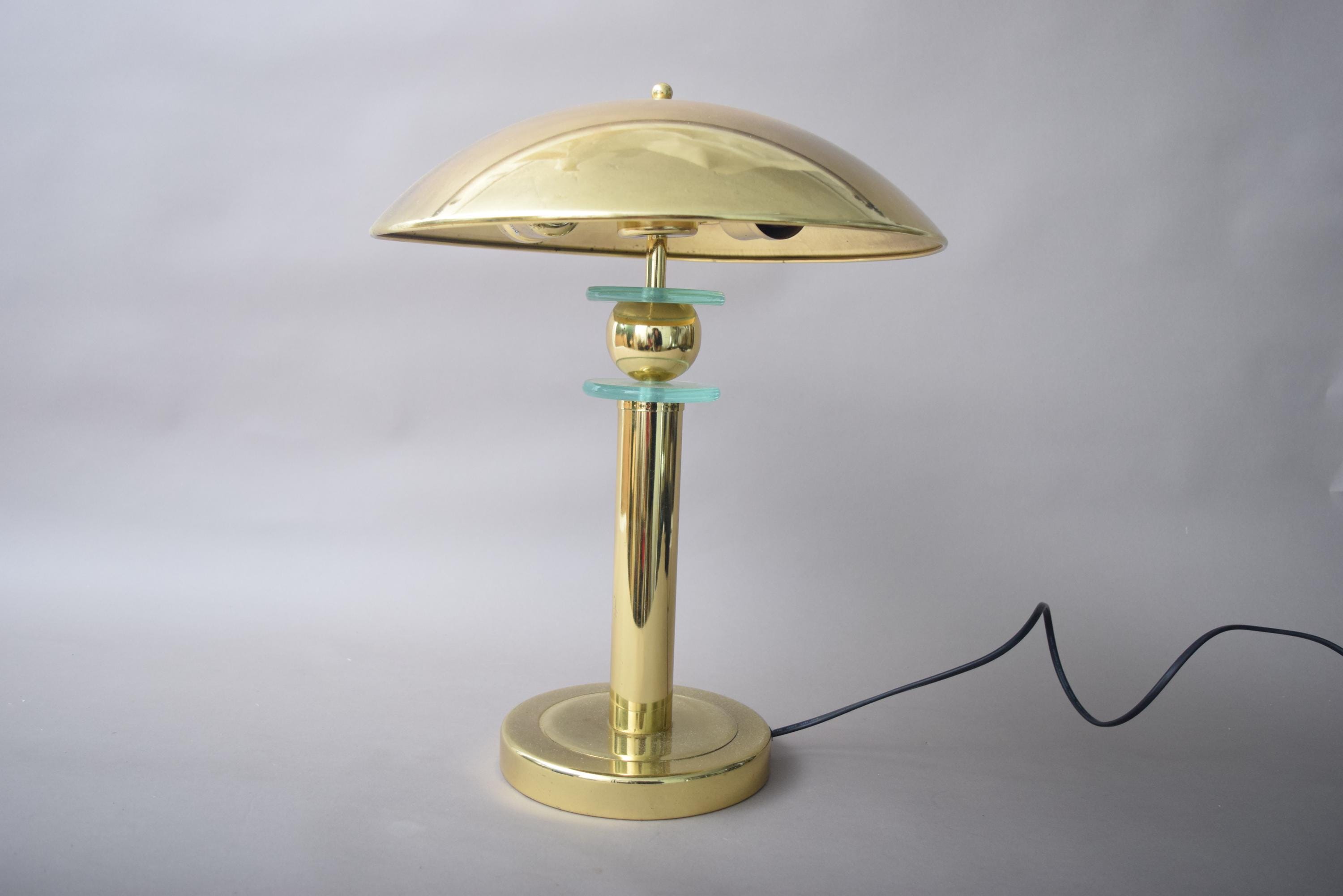Elegant vintage mushroom lamp featuring a polished brass finish and a distinctive mushroom-shaped shade. This mid-century modern table lamp adds a touch of retro charm to any room, making it perfect for bedside tables, desks, or reading nooks. Its warm, ambient light creates an inviting atmosphere, while the compact design ensures it fits seamlessly into various interior spaces.