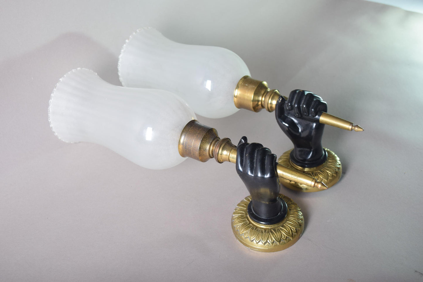 Art Deco Pair of solid brass wall scones fist holding torch 1930s