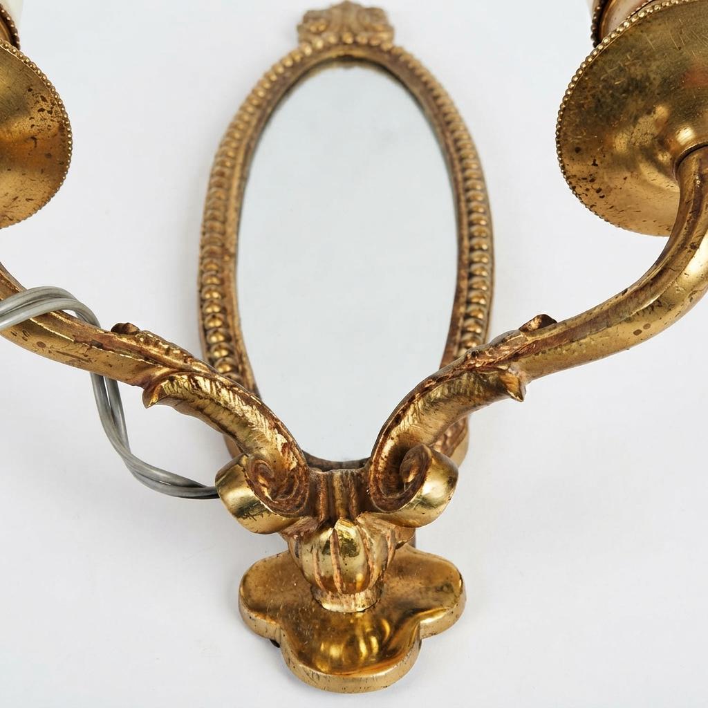 Pair of French Vintage Gilt Brass Wall Sconces, Two Arm with Oval Mirror Backplate — France, Mid-20th Century