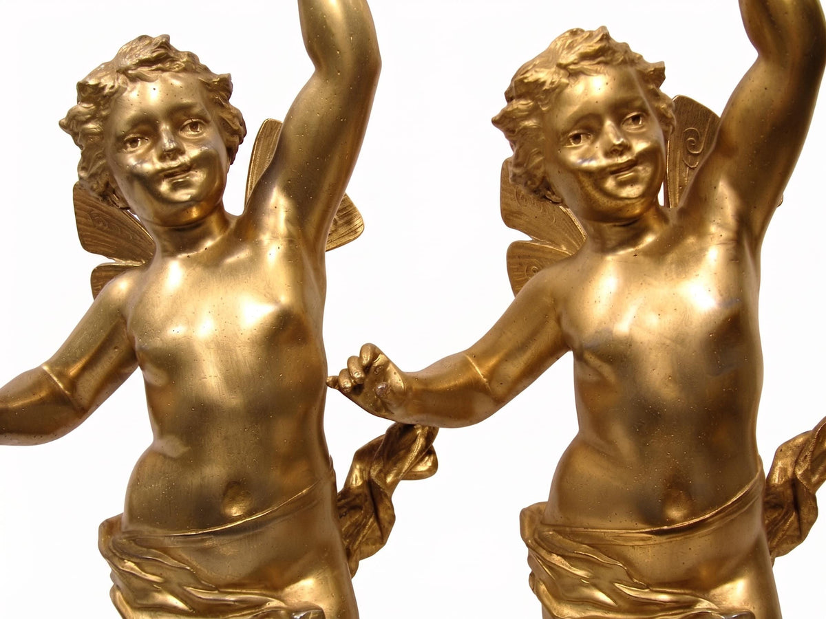 Pair of French Gilt Putti Table Lamps, Winged Cherub Figures on White Marble Bases — France, Early 20th Century