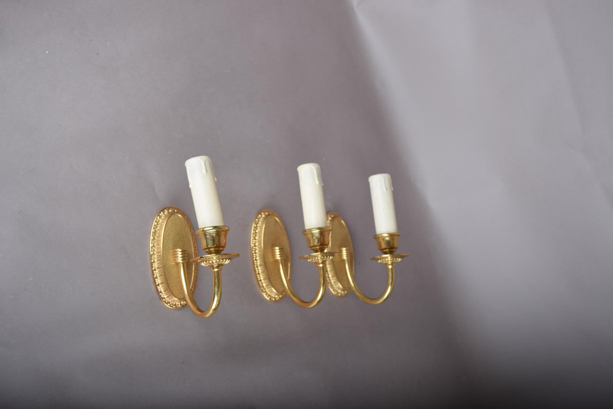 Louis XVI Style Wall Sconces Set of Three, Gilt Metal Single Arm Sconces with Oval Beaded Backplates