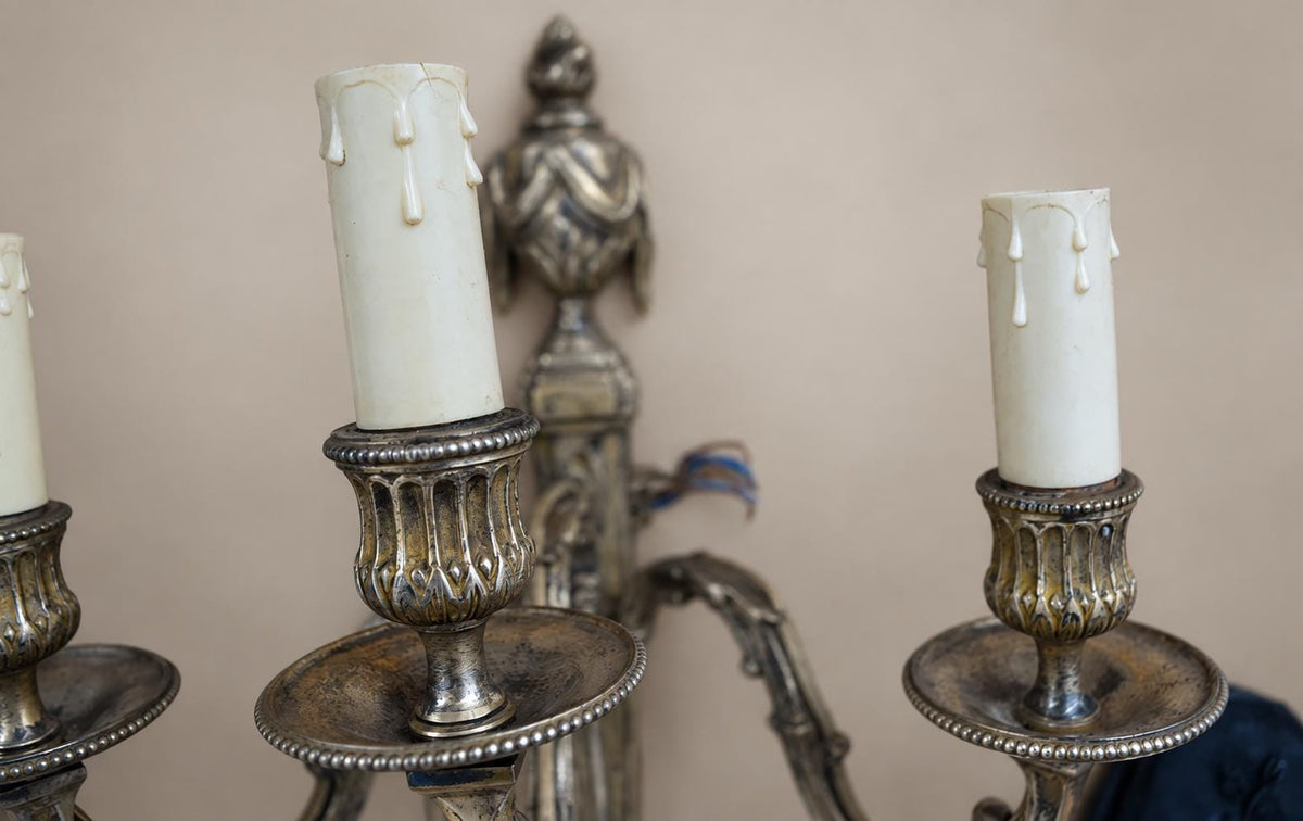 Pair of French Neoclassical Style Patinated Metal Three-Light Wall Sconces Mid 20th