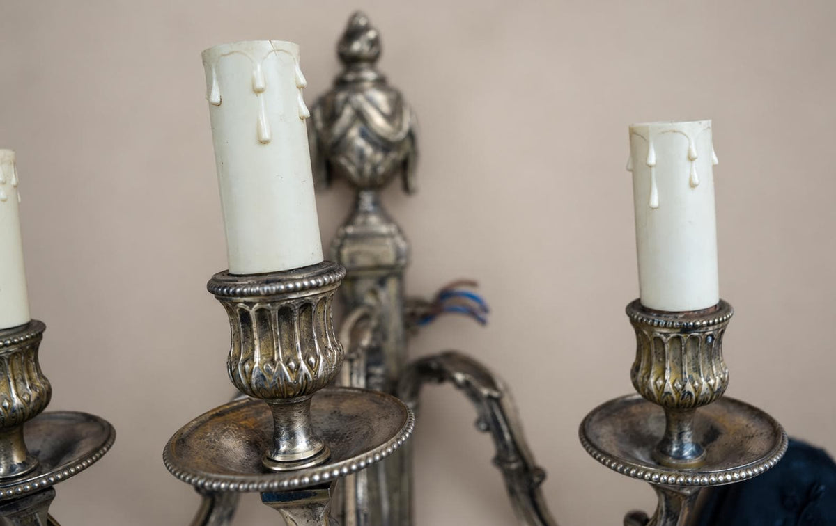 Pair of French Neoclassical Style Patinated Metal Three-Light Wall Sconces Mid 20th