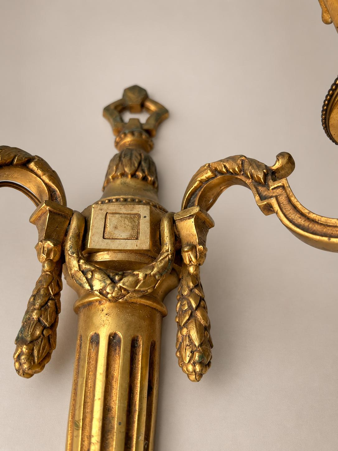 Pair of French Neoclassical Style Patinated Metal Two-Light Wall Sconces Mid 20th Century