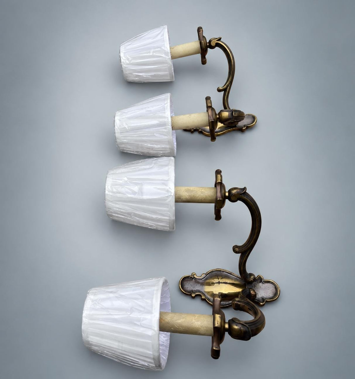 Pair of French Patinated Brass Two-Arm Wall Sconces, with White Fabric Shades — France, circa 1950
