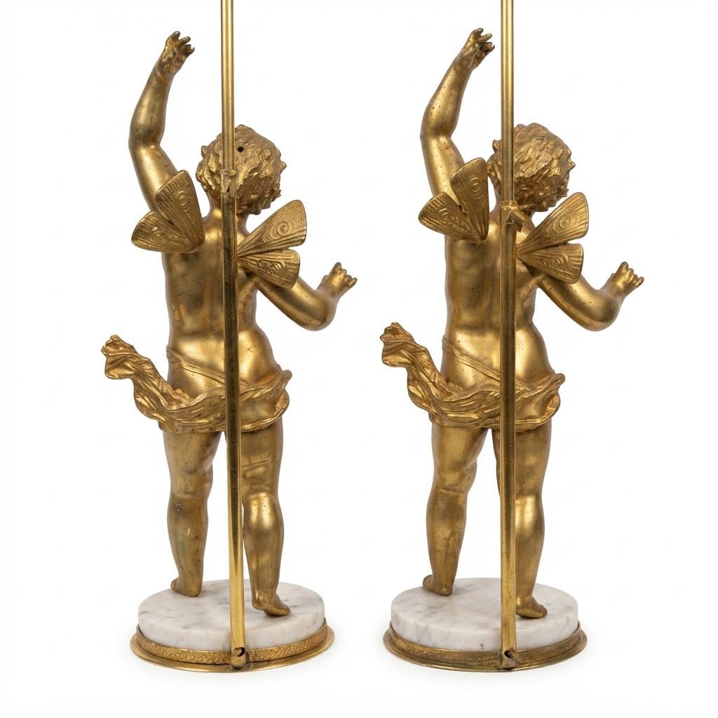 Pair of French Gilt Putti Table Lamps, Winged Cherub Figures on White Marble Bases — France, Early 20th Century