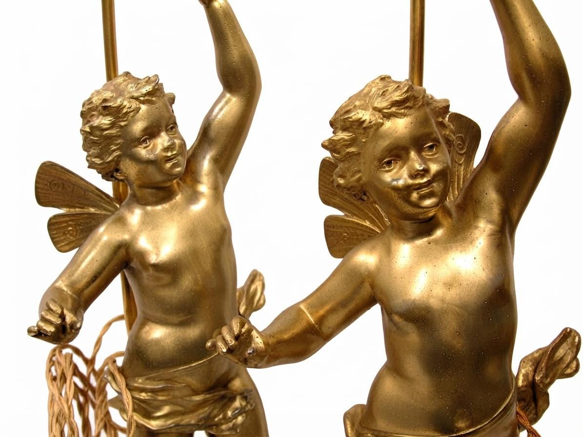 Pair of French Gilt Putti Table Lamps, Winged Cherub Figures on White Marble Bases — France, Early 20th Century