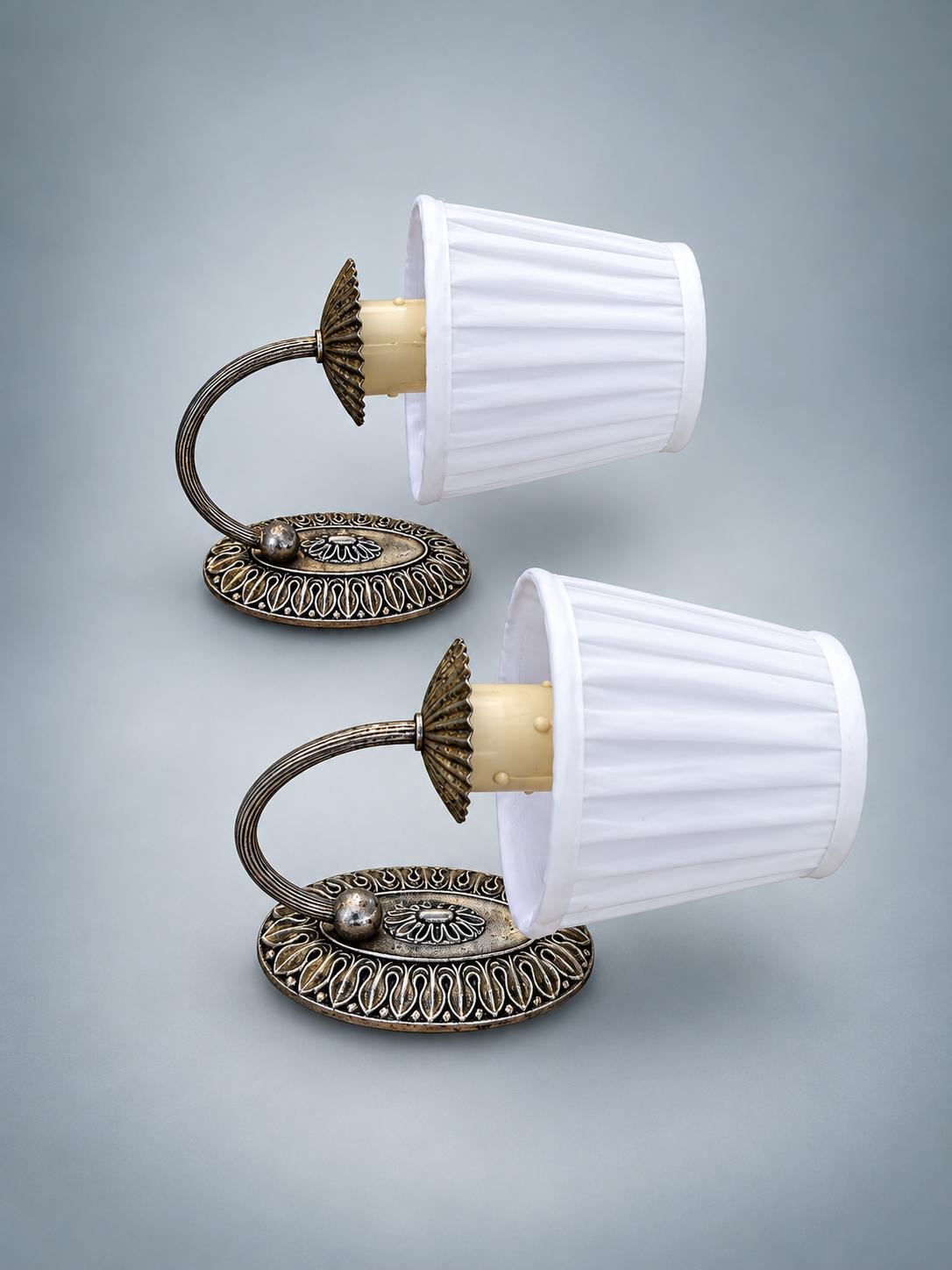 Pair of Vintage Silvered Metal Wall Sconces — Pierced Oval Backplate with Scrolled Ring Arm, Pleated Shades