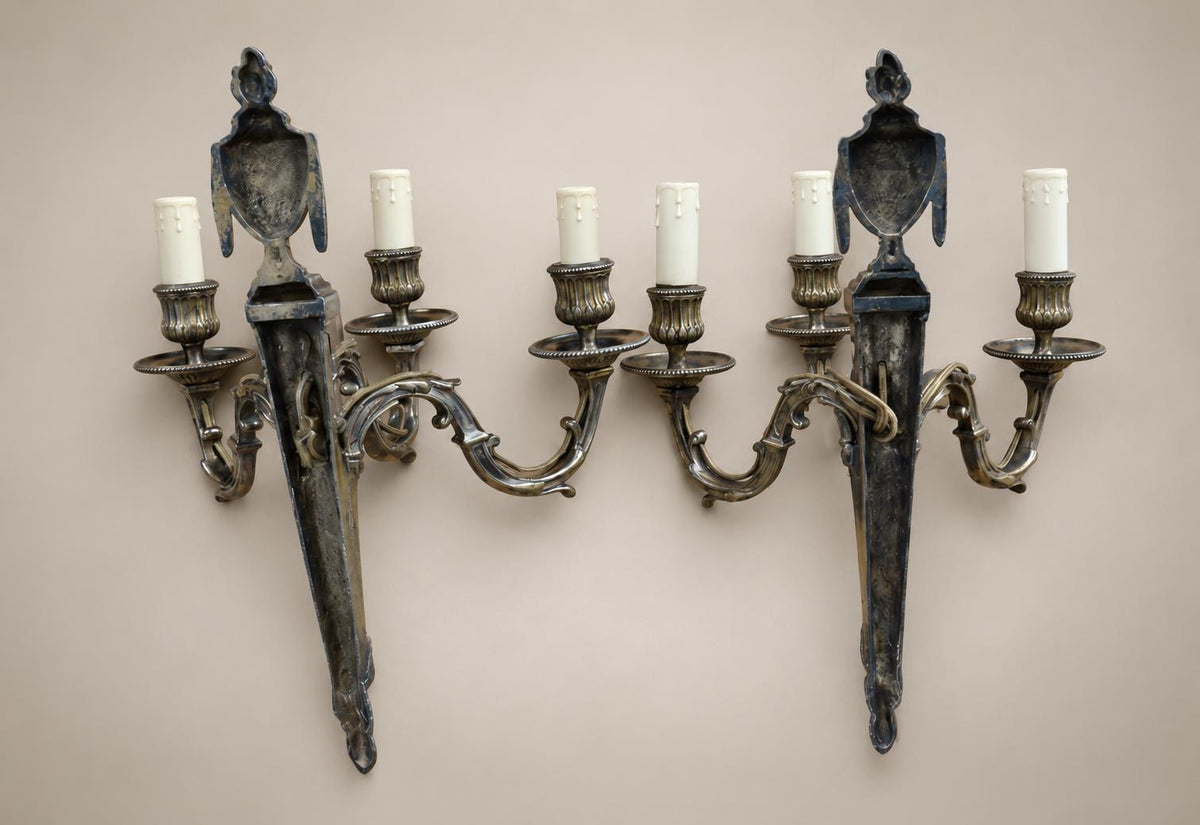 Pair of French Neoclassical Style Patinated Metal Three-Light Wall Sconces Mid 20th