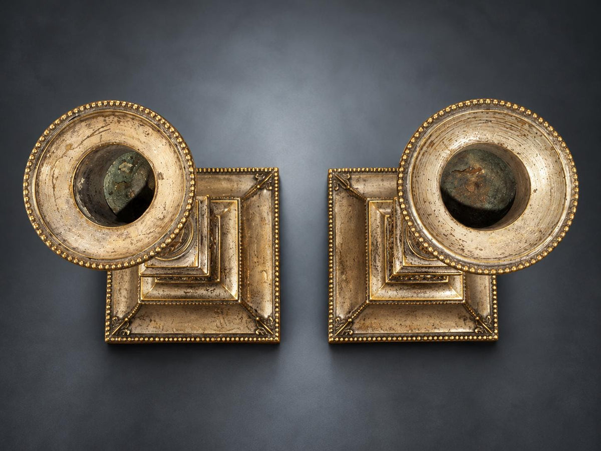 Pair of Neoclassical Candlesticks, Silver-Tone Metal with Ram's Heads and Garlands, Fluted Urn Sconces, Warm Worn Finish