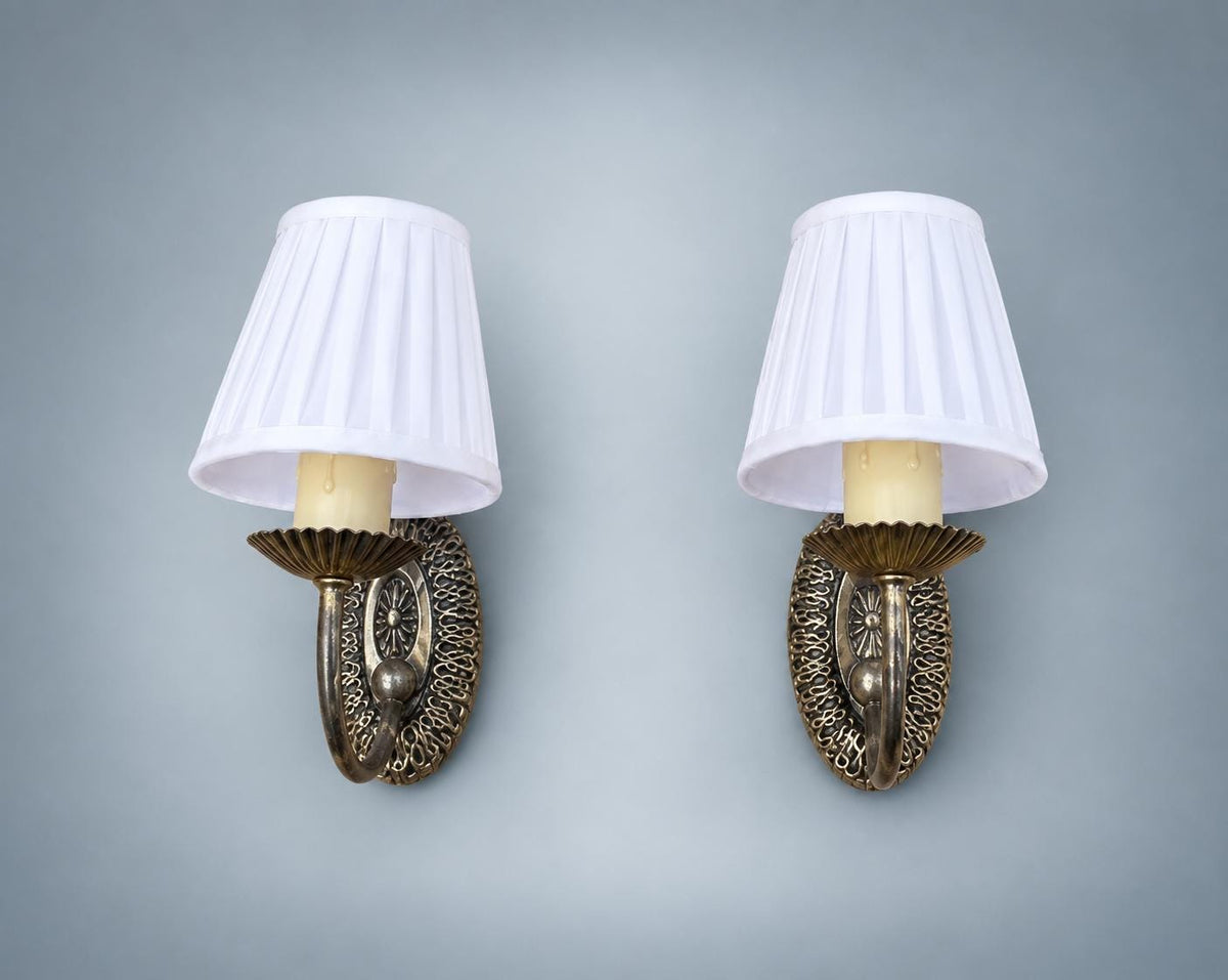 Pair of Vintage Silvered Metal Wall Sconces — Pierced Oval Backplate with Scrolled Ring Arm, Pleated Shades