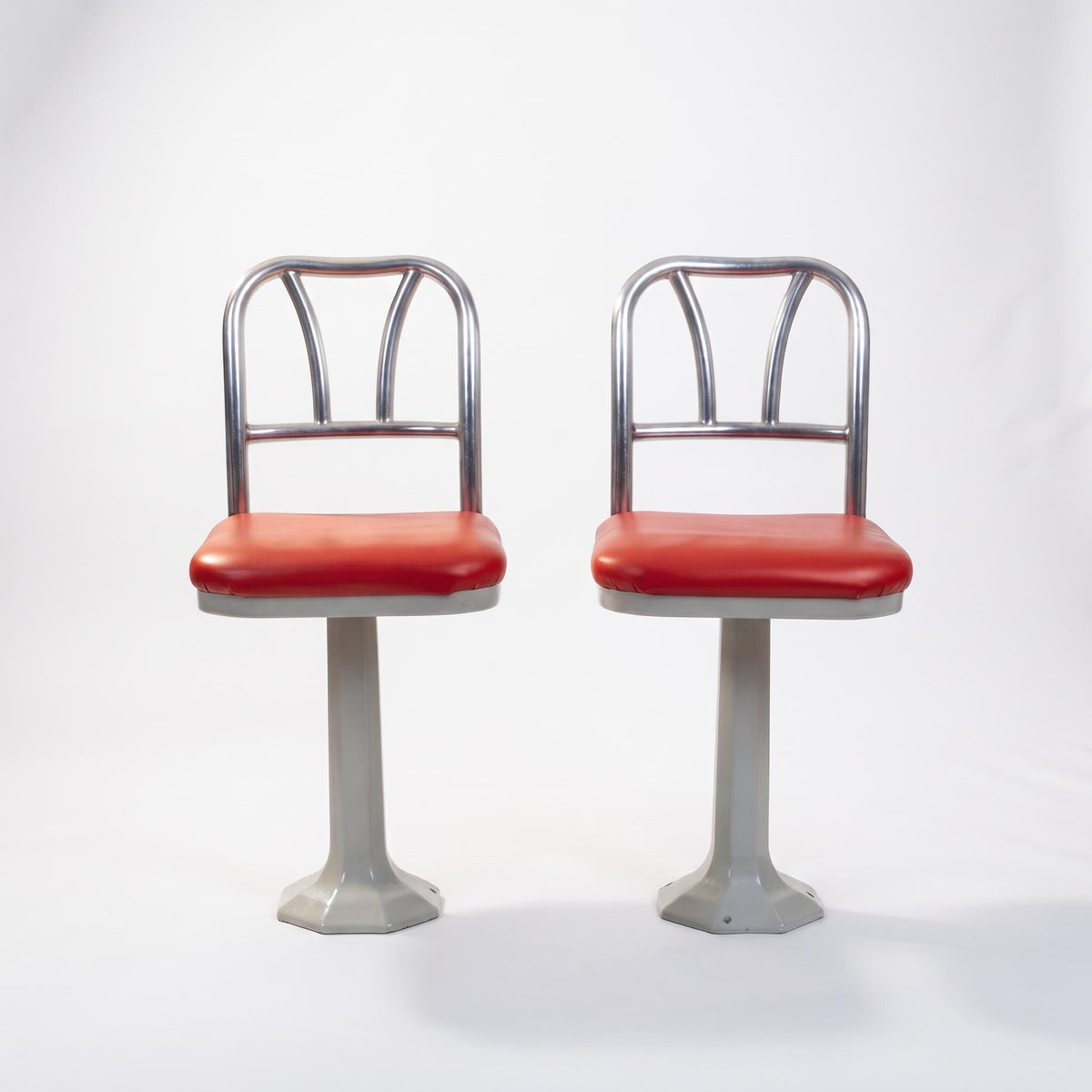 Pair of Vintage Chrome Soda Fountain Chairs — Swivel Pedestal Diner Stools with Red Vinyl Seats