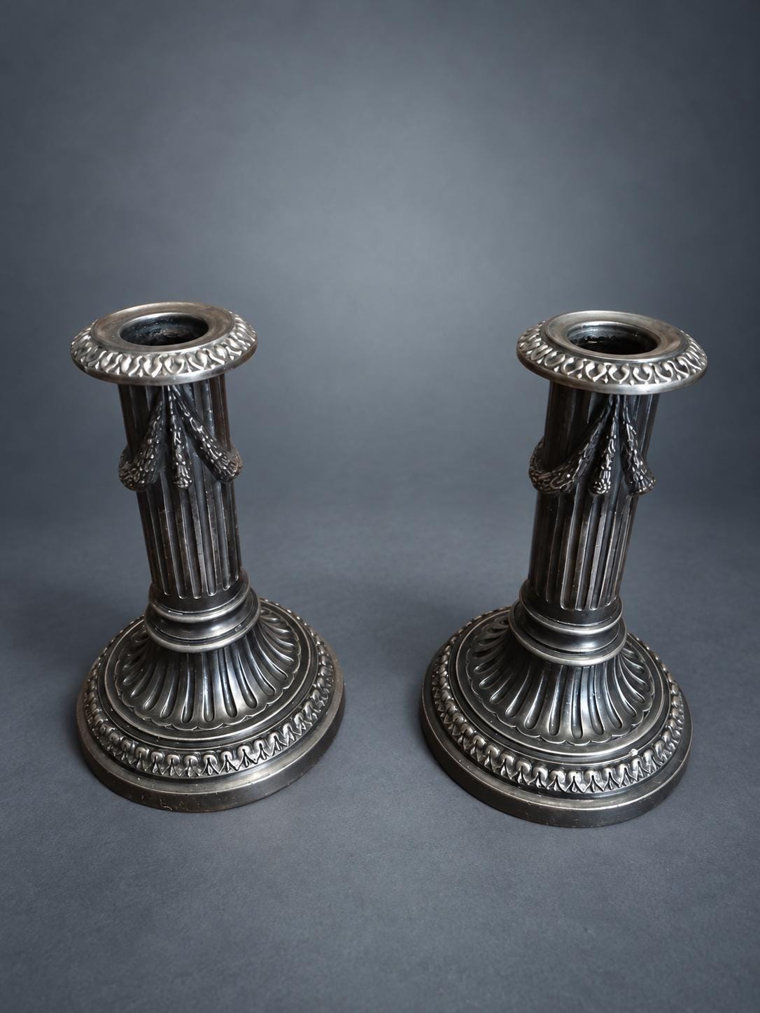 Pair of Napoleon III Style Column Candlesticks, Silver-Tone Metal, Fluted Stems with Ribbon-Tied Garlands, Gadrooned Bases