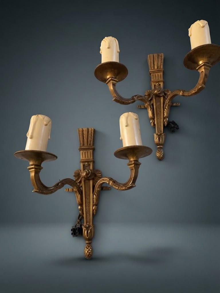 Pair of Small Louis XVI Style Two-Arm Wall Sconces, Bronze-Tone Quiver Backplates with Arrows, Ribbons and Pine Cone Drops