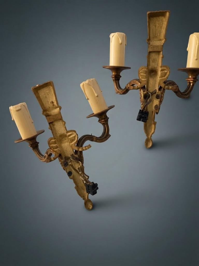 Pair of Small Louis XVI Style Two-Arm Wall Sconces, Bronze-Tone Quiver Backplates with Arrows, Ribbons and Pine Cone Drops